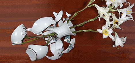 Broken vase with flowers